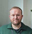A male looking at the camera and smiling